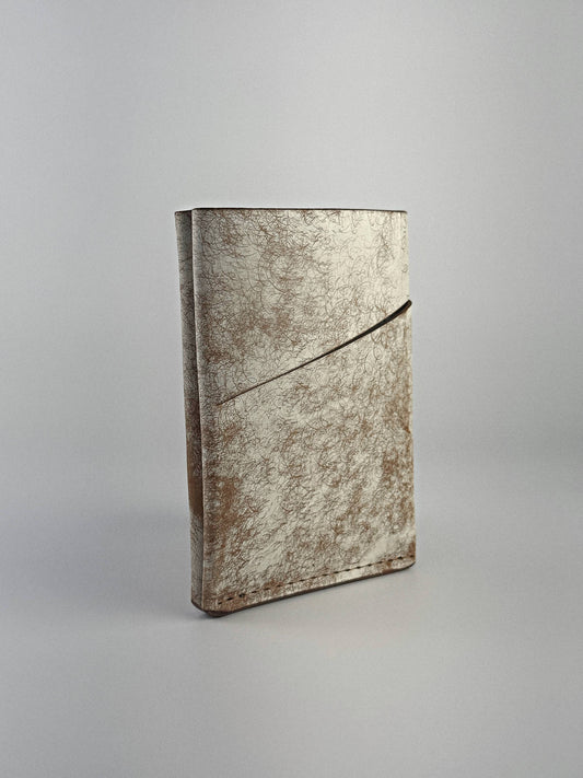 Brown keeper leather wallet front closed view, on a white background