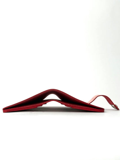 red glance leather wallet with strap, opened edge view lying and closed