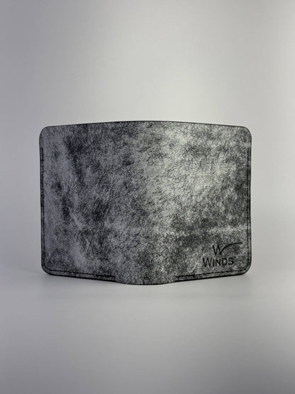 black glance leather wallet back side view with Winds logo, on a white background
