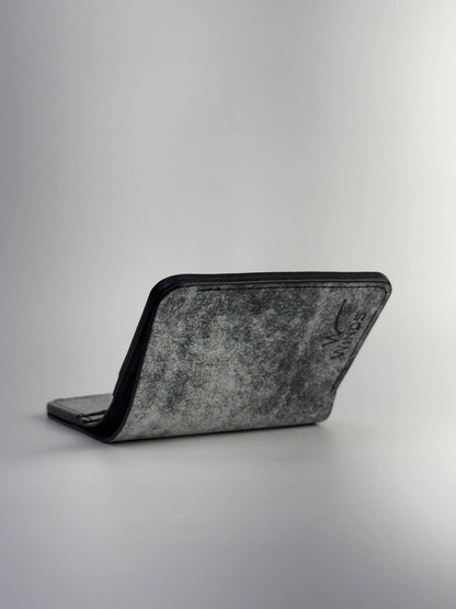 black glance leather wallet lying opened front view with Winds logo, on a white background