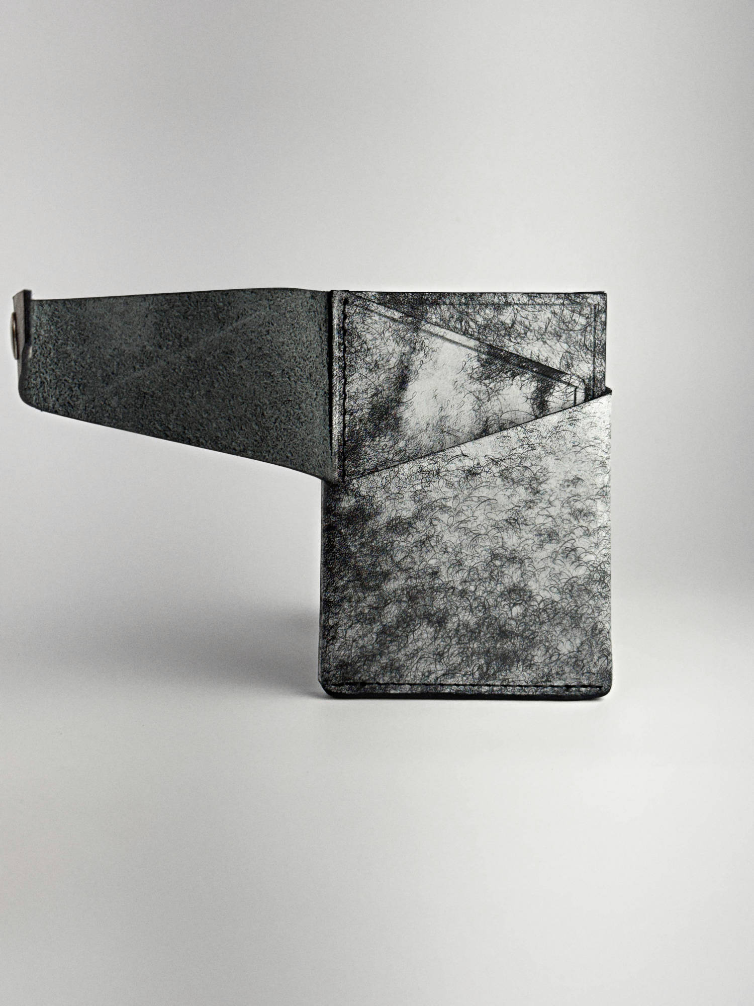 black keeper leather wallet opened front side view on a white background