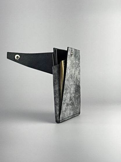 black keeper leather wallet opened rotated edge side view on a white background