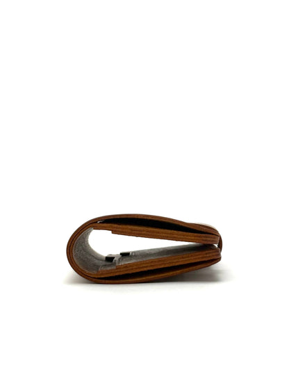 brown glance leather wallet with strap, closed edge view lying and closed