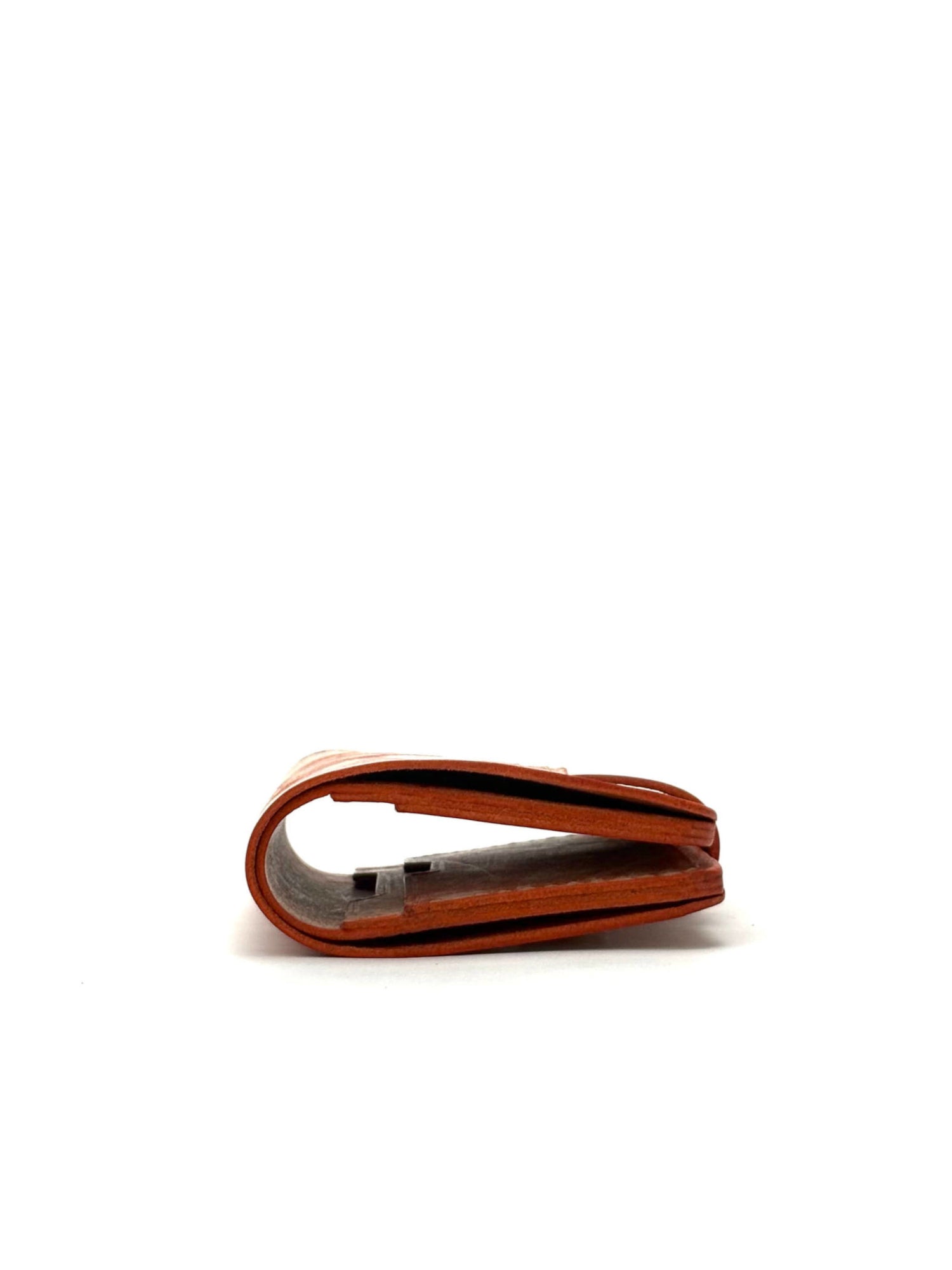 orange glance leather wallet with strap, closed edge view lying and closed