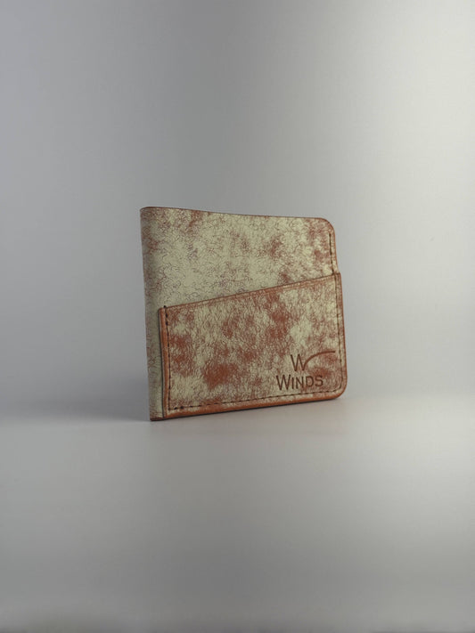orange wing leather cardholder rotated front side with Winds logo, on a white background