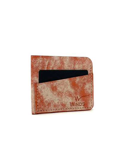 orange wing leather cardholder front view rotated with cards and Winds logo