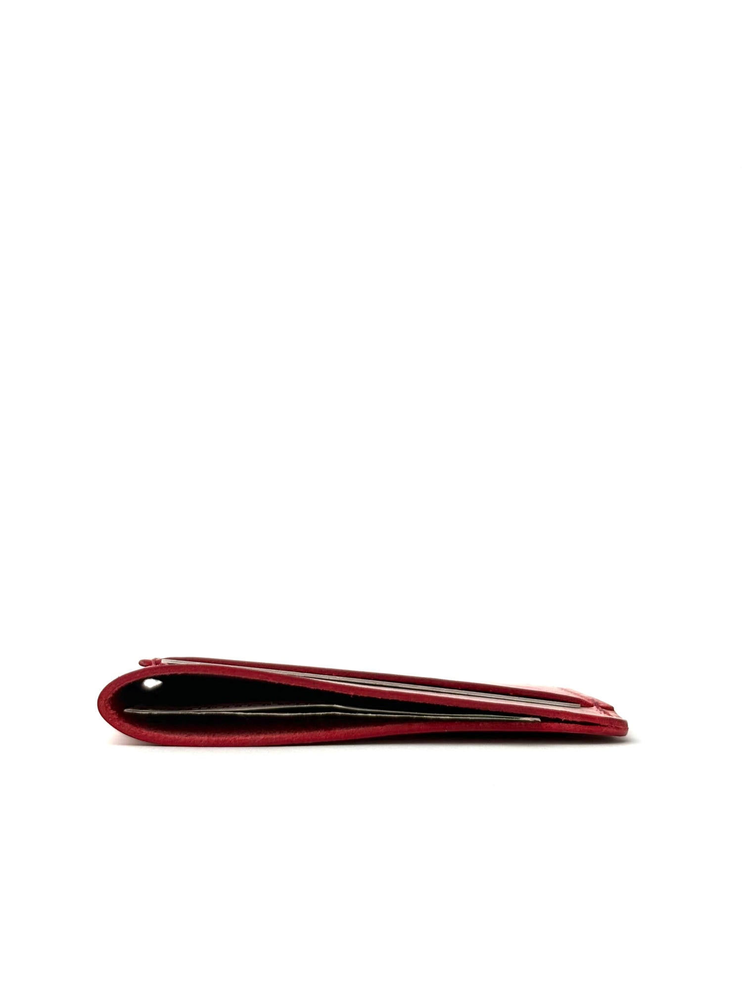 red wing leather cardholder edge view with cards and cash laing